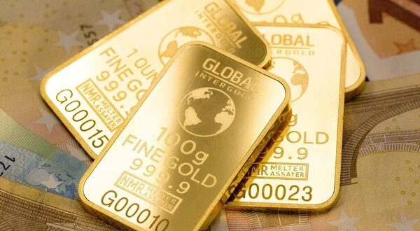 Gold price falls on easing trade worries, silver price rises.